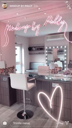 an image of a beauty salon with pink neon lights on the counter and chairs in front of it