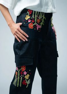 These jeans redefine casual elegance, featuring exquisite embroidery meticulously crafted onto the pockets, elevating your ensemble with a distinctive flair. Designed for the fashion-forward individual, these jeans seamlessly blend contemporary trends with timeless charm. The cargo pockets add a touch of utility, while the intricate embroidery ensures you stand out in any crowd. Step into fashion excellence with Pocket Thread Cargo Jeans, where every stitch tells a story of sophistication and st Women Cargo Pants, Into Fashion, Jeans Cargo, Scarf Poncho, Intricate Embroidery, Cargo Pocket, Women Cargos, Confident Woman, Girls Denim