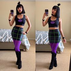 a woman taking a selfie with her cell phone in front of the camera and wearing purple tights