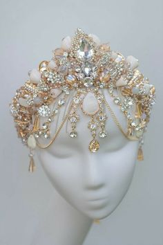 a white headpiece with lots of jewels on it