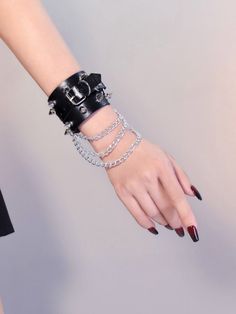 Elevate your cyberpunk style with our gothic black studs cyberpunk PU wristband bracelet with chains. Made from high-quality PU leather, this wristband features edgy studs and chains that add a bold statement to your outfit. The black color provides a dark, mysterious vibe, perfect for expressing your unique fashion sense.   Please note that this product includes only one bracelet.  Garment Size   	 		 			Size 			Free Size 		 		 			Adjustable Circumference 			20-23 		 		 			Width 			5 Silver Rivets Wristband For Concert, Edgy Black Metal Wristband, Punk Style Leather Bracelet With Rivets, Punk Leather Bracelet With Rivets, Punk Style Black Wristband For Festivals, Adjustable Metal Punk Chain Bracelet, Black Riveted Bracelets For Concerts, Black Leather Bracelet With Rivets For Concerts, Adjustable Metal Chain Bracelet, Punk Style