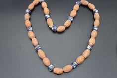 Vintage terracotta ceramic beaded necklace. The beads are carved and are spaced with smaller hand painted beads. The necklace does not have a fastening and just slips over the head. In lovely condition. To note - We do our best to describe things as accurately as possible but please look at all photographs carefully as they form part of the description. Our items are all vintage and will have some wear unless stated.  Postage - we do combine postage. Packaging - your item will come in a little delivery box and will be wrapped carefully inside the box. All packaging is recyclable. We aim to post within 3 working days of payment. Any queries don't hesitate to contact us, always happy to help. Thank you! Unique Brown Jewelry For Ceremonial Occasions, Traditional Round Faceted Jewelry, Antique Collectible Necklaces With Round Beads, Antique Gemstone Beaded Necklace, Vintage Jewelry With Polished Oval Beads, Antique Gemstone Necklace With Round Beads, Vintage Carved Round Necklaces, Handmade Oval Ceremonial Necklace, Traditional Carved Necklaces For Formal Occasions