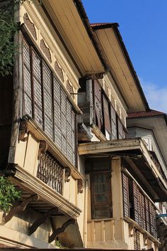 an old building with lots of windows and balconies