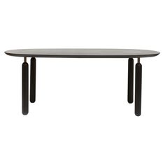 an oval table with two black legs