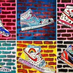 four different colored sneakers painted on brick wall