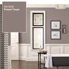 a bathroom with gray walls and white trim on the walls, along with a bathtub