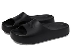 PUMA Shibusa - Women's Shoes : Puma Black/Puma Black : Get ready to step out in style and ultimate comfort by choosing the PUMA Shibusa! These slides feature a sleek design with a rubber upper and lining, ensuring durability and flexibility. The cushioned footbed, combined with a fully injected IMEVA midsole, provides exceptional comfort for all-day wear. Slip-on style. Minimalist PUMA strap branding. Open, round toe design. Fully injected IMEVA midsole and outsole. Imported. Shoes Puma, Black Puma, Puma Women, Style Minimalist, Toe Designs, Sneakers Athletic, Sleek Design, Women's Shoes, Womens Sneakers