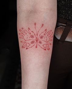 a woman's arm with red ink on it