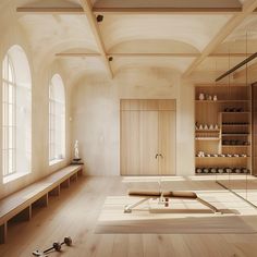 an empty room with wooden floors and shelves on the wall, along with several pairs of shoes