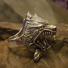 *  Amazing Details in this Wolf Ring, great texturing on the fur.*   Approx. 25mm x 40mm over 3/4 ounce of silver*  Hand made in our workshops in Devon*  .925 fully hall marked sterling silver ring*  Available in M - Z (use the drop down menu to order)*  Special Sizes are available on request Viking Style Silver Wolf Design Jewelry, Viking Style Silver Jewelry With Wolf Design, Medieval Silver Rings For Larp, Collectible Viking Sterling Silver Jewelry, Silver Wolf Design Symbolic Jewelry, Viking Style Silver Outdoor Jewelry, Silver Symbolic Wolf Design Jewelry, Symbolic Silver Wolf Design Jewelry, Silver Gothic Jewelry For Costume