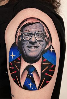 a man's arm with a portrait of bill clinton in the center and stars around it