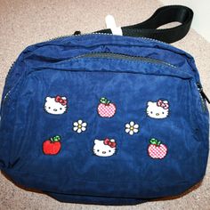 Hello Kitty Sanrio X Baggu Embroidered Fanny Pack Crossbody Bag New W/ Tags Made From Durable, Heavyweight Nylon For Easy Cleaning Wear Across Your Body, Over Your Shoulder Or Around Your Waist. Measures Approx.: 9" L X 3.5" W X 7.5" H. Two Main Compartments Interior Zip Pocket. 45.5" Adjustable Strap. Blue Pouch Belt Bag With Zipper Pocket, Blue Belt Bag As Mobile Phone Shoulder Bag, Casual Blue Embroidered Bag, Blue School Bag With Cell Phone Pocket, School Bag With Cell Phone Pocket In Blue, Casual Blue Belt Bag With Mobile Phone Pocket, Blue Pouch Belt Bag With Cell Phone Pocket, Blue Belt Bag With Cell Phone Pocket, Blue Belt Bag With Adjustable Strap For School