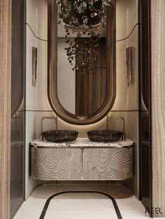 a bathroom with a vanity, mirror and chandelier