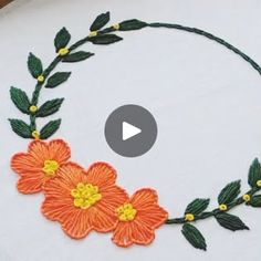 a video demonstrating how to make an embroidered flower wreath with leaves and flowers on it