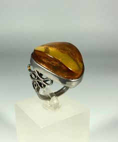 Discover the timeless elegance of our Spectacular Orange-Brown Amber Ring, expertly crafted for ladies in stunning 925 sterling silver. This exquisite piece features natural Baltic Sea amber, renowned for its unique beauty and healing properties. Perfect for any occasion, this amber ring will add a touch of sophistication to your jewelry collection. Product Details: Material: 925 Sterling Silver Stone: Natural Baltic Sea Amber Color: Spectacular Orange-Brown Design: Minimalist Style Ring Size: 8 Timeless Oval Rings With High Luster, White Gold Rings With Shiny Finish For Gift, Classic Oval Rings With High Luster, Classic Oval Ring With High Luster, Timeless High Luster Rings For Formal Occasions, Classic Oval High Luster Ring, White Gold Wedding Jewelry With Polished Edges, Luxury Silver Ring With Shiny Finish, Fine Jewelry Sterling Silver Ring With Polished Finish