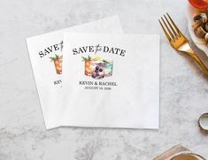 save the date napkins on top of a table with food and utensils