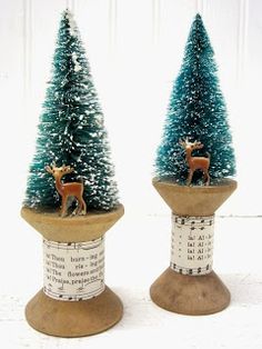 two small christmas trees sitting on top of each other