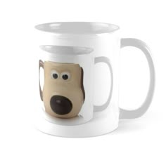 a coffee mug with a dog's face painted on the front and side of it