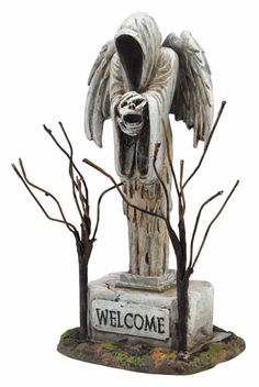 an angel statue with the words welcome on it