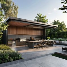 an outdoor kitchen and dining area is shown