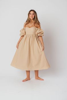 The Hamilton is everything you're looking for in a midi dress - charming, sophisticated, and absolutely flattering. It features premium quality details, like a sweetheart neckline and gorgeous balloon sleeves that can be worn on or off the shoulder. It's an unforgettable choice for every body type, and extra-comfy for expecting mamas! The best part? You can wear this beauty long after your sweet baby arrives! Available in multiple colorways. FIT: Runs true to size. Features a smocked back panel for comfort. This dress is roomy in the waist and will accommodate early maternity in your true size, but consider sizing up if you are in advanced pregnancy. MATERIAL: GARMENT DETAILS: Empire-waisted midi dress, with sweetheart neckline and statement balloon sleeves that can be worn on or off the s Midi Dress With Ruched And Fitted Bodice For Brunch, Elegant Puff Sleeve Bubble Dress For Spring, Elegant Spring Bubble Dress With Puff Sleeves, Elegant Billowy Puff Sleeve Dress, Elegant Bubble Dress With Puff Sleeves For Spring, Elegant Voluminous Knee-length Midi Dress, Feminine Voluminous Square Neck Dress, Feminine Midi Dress With Sweetheart Neckline For Casual Occasions, Feminine Midi Dress With Sweetheart Neckline For Casual Wear