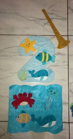 the bathroom floor is decorated with various sea animals