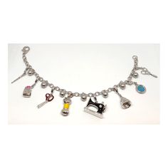 "Sewing Accessories Charm Bracelet Rhodium Plated Metal Alloy Set With Enamel     *    This whimsical rhodium plated bracelet features 8 \"Sewing\" themed charms including a tape measure, sewing machine, scissors and a thimble. This unique bracelet would make the perfect gift for any sewing enthusiast.       *    Rhodium plated Sewing charm bracelet set with enamel     *    Supplied in a Gift Box with a Certificate of Authenticity     *    Dimensions: 195mm (7 1/2 inches)" White Gold Metal Chain Bracelet With Charms, White Gold Chain Bracelet With Charms, Jewelry Making Bracelet With Removable Charms, Removable Charms Bracelet, Adjustable White Gold Charm Bracelet With Lobster Clasp, Adjustable White Gold Charm Bracelets, Metal Charm Bracelets For Jewelry Making, Silver Chain Bracelet With Charms For Jewelry Making, Silver Charm Bangle Chain Bracelet