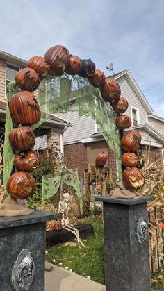 an outdoor halloween decoration with carved pumpkins