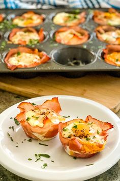 the muffins are ready to be eaten on the plate and placed in the muffin tin