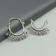 A PAIR of indian style sterling silver ear hoops. Size: 18 x 20 mm Price listed is for a pair of ear hoops. These earrings are made of 925 hypoallergenic sterling silver. All my pieces are sent in a gift box. I can include a personal message from you if needed. You are welcome to contact me at... bhavnakwintra1956@gmail.com More hoops: https://www.etsy.com/your/shops/TheSilverGame/tools/listings/section:26305414 More earrings: https://www.etsy.com/your/shops/TheSilverGame/tools/listings/section: Bohemian Single Hoop Cartilage Earring, Bohemian Round Hoop Earrings, Hypoallergenic, Small Hoop Hypoallergenic Festival Earrings, Nickel-free Small Hoop Bohemian Cartilage Earrings, Nickel-free Bohemian Small Hoop Cartilage Earrings, Bohemian Silver Nose Rings Nickel Free, Bohemian Metal Hoop Cartilage Earrings, Bohemian Nickel-free Small Hoop Cartilage Earrings, Bohemian Round Hypoallergenic Hoop Earrings