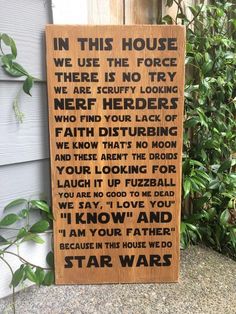 a wooden sign that says in this house we use the force