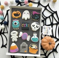 a halloween card with lots of decorated cookies