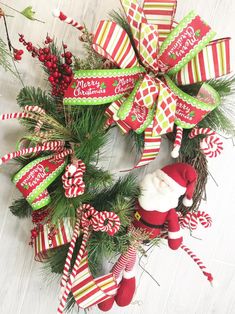 a christmas wreath decorated with candy canes and ornaments