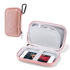 an open pink case sitting on top of a white table