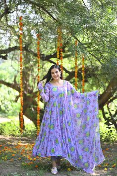 PRODUCT DESCRIPTION :-Presenting lavender floral chiffon tiered pattern Anarkali with matching Chiffon dupatta and cotton Pants . This Anarkali will give you most beautiful vibe with comfortable Feel. Anarkali :- Chiffon Pant :- CottonDupatta :- ChiffonClosure Used:- Side zipColor:- LavenderCare Instructions :- Dry clean onlyModel Size :- Model is wearing XS sizeModel Height :- 5.6''DISCLAIMER :- Slight color variations may occur due to different screen resolution. Bohemian Purple Sets With Dupatta, Bohemian Purple Set With Dupatta, Bohemian Georgette Anarkali Set For Diwali, Traditional Lavender Sharara With Sheer Dupatta, Lavender Anarkali Floor-length Set, Bohemian Georgette Anarkali Set With Printed Motifs, Purple Chikankari Embroidered Floor-length Salwar Kameez, Bohemian Anarkali Set With Printed Motifs, Purple Floor-length Chikankari Embroidered Sharara