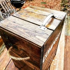 a wooden box sitting on top of a wooden deck