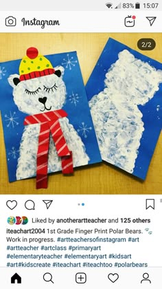 two polar bears made out of paper on top of a table