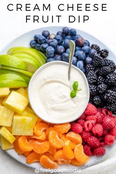 a white plate topped with fruit and dip