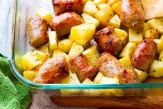 a glass dish filled with sausage and potatoes