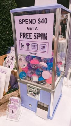 a display case filled with lots of different types of buttons on top of a table