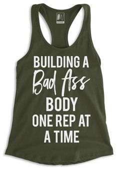 Building a Bad As* Body, NoBull Woman Apparel Racerback Tank Top - Pick Color, $24.95. Click here to buy https://nobullwoman-apparel.com/collections/fitness-tanks-workout-shirts/products/building-a-bad-ass-body-racerback-tank-top-pick-color Muscle Building Women, Build Tank, Time Graphic, Bodybuilding Program, Fitness Tank Top, Reading Themes, Get It Girl, Mom Funny, Shirts Graphic