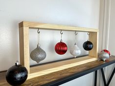 a shelf with ornaments hanging from it's sides