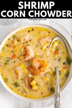 shrimp corn chowder in a white bowl with a spoon and napkin on the side