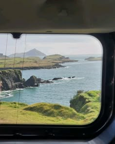 the view from inside a vehicle looking out at an ocean