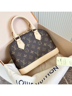 Gender: Women Brand: LOUIS VUITTON Product Name: Alma BB Monogram Shoulder Bag Brown Bags Alora Code: 83290014 Color: brown Composition: Canvas, Cowhide Leather Origin: France Features: Removable Strap Adjustable Strap Zipped closure Designer Style ID M46990 Alma Bb Monogram, Bb Monogram, Alma Bb, Shoulder Bag Brown, Brown Bags, Timeless Handbag, Luxe Fashion, Designer Style, Bags Designer Fashion