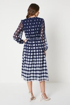 Flattering midi length with a polka dot ombre print
Round neckline for a timeless, elegant look
Belted waist to accentuate your curves
Long sheer sleeves for a touch of sophistication
Crafted from woven fabric for a luxurious feel
Exude effortless glamour in this polka dot midi dress from Wallis. The ombre print adds a modern twist, while the belted waist and round neckline create a flattering, feminine silhouette. Pair with heels and a clutch for a chic workwear ensemble, or style with strappy sandals for a refined evening look. This versatile piece is perfect for any formal occasion where you want to make a stylish statement. Dresses Tall, Chic Workwear, Polka Dot Midi Dress, Ombre Print, Work Wear Outfits, Belted Midi Dress, Trending Boots, Feminine Silhouette, Sheer Sleeves