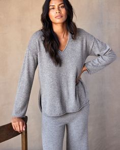 Sweater sets are having a moment, and we're here for it. Wear this super soft v-neck on its own or pair it our matching Stowaway Pant for an easy throw-on-and-go fall fit. Stay warm while looking effortlessly pulled together in this luxurious blend of superfine wool and recycled cashmere. Relaxed v-neck sweater with drop shoulders, side slits and high-low hem. Made with a fine 12-gauge Italian yarn with roll edge neckline and hem. Sweater Sets, Summer Layers, Fall Fit, Henley Sweater, Polo Sweater, Women's Sweaters, Sweater Set, Grey Women, High Low Hem