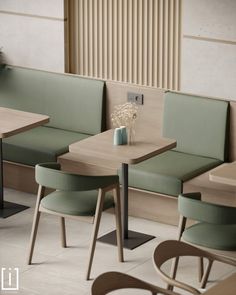 two tables with green seats in a restaurant