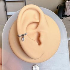 a fake ear with a ring on top of it