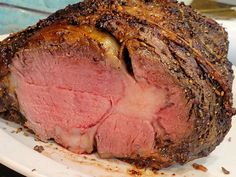 a large piece of meat sitting on top of a white plate